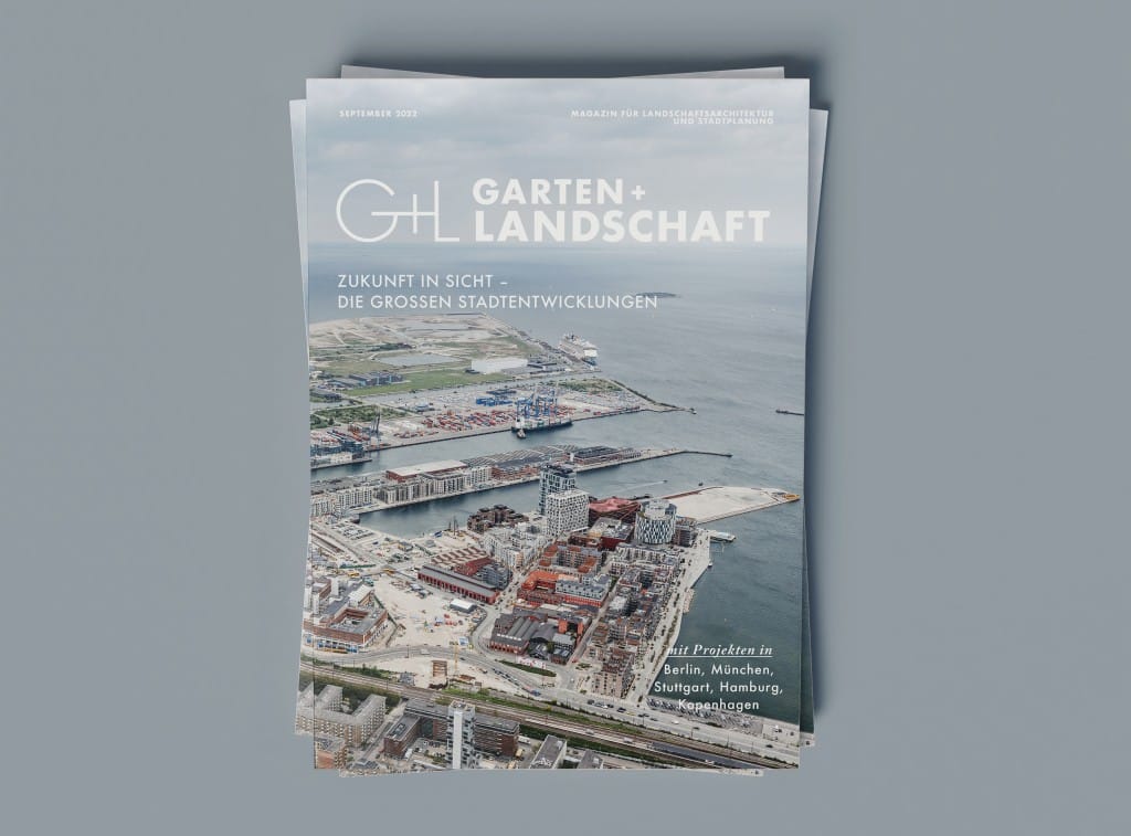 Cover der Zeitschrift Garten+Landschaft, darauf eine Luftaufnahme eines Hafengebiets mit Containern, mehreren Wohnbauten und Meer. Coverfoto: Rasmus Hjortshøj - COAST